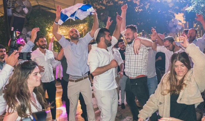 a group of people dancing at a party